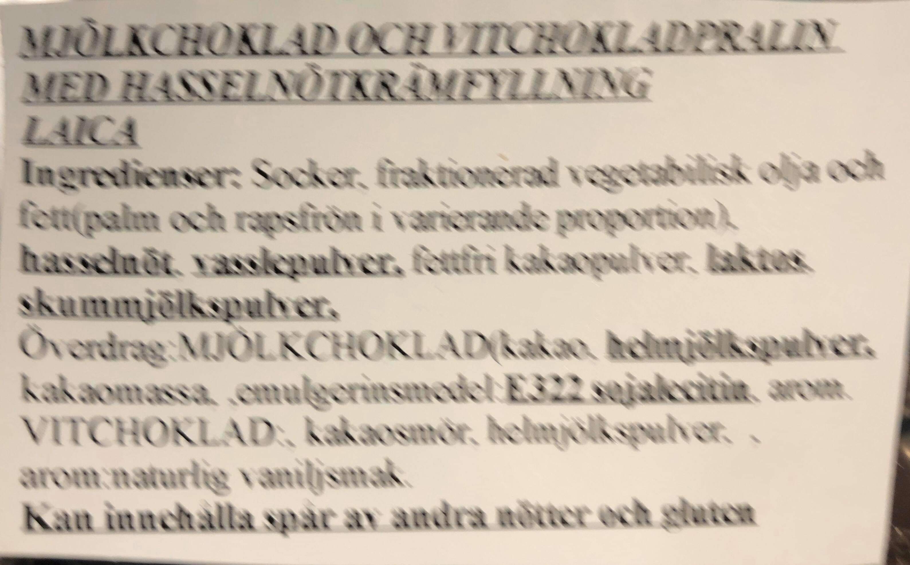 Mjlkchoklad och vitchokladpralin med hasselntskrmfyllning